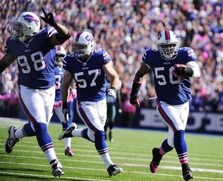 Bills force Vick to throw 4 INT’s; win 31-24