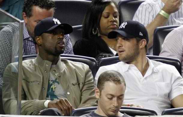tebow Tim Tebow gets booed at Yankee Stadium while chillin with Dwyane Wade
